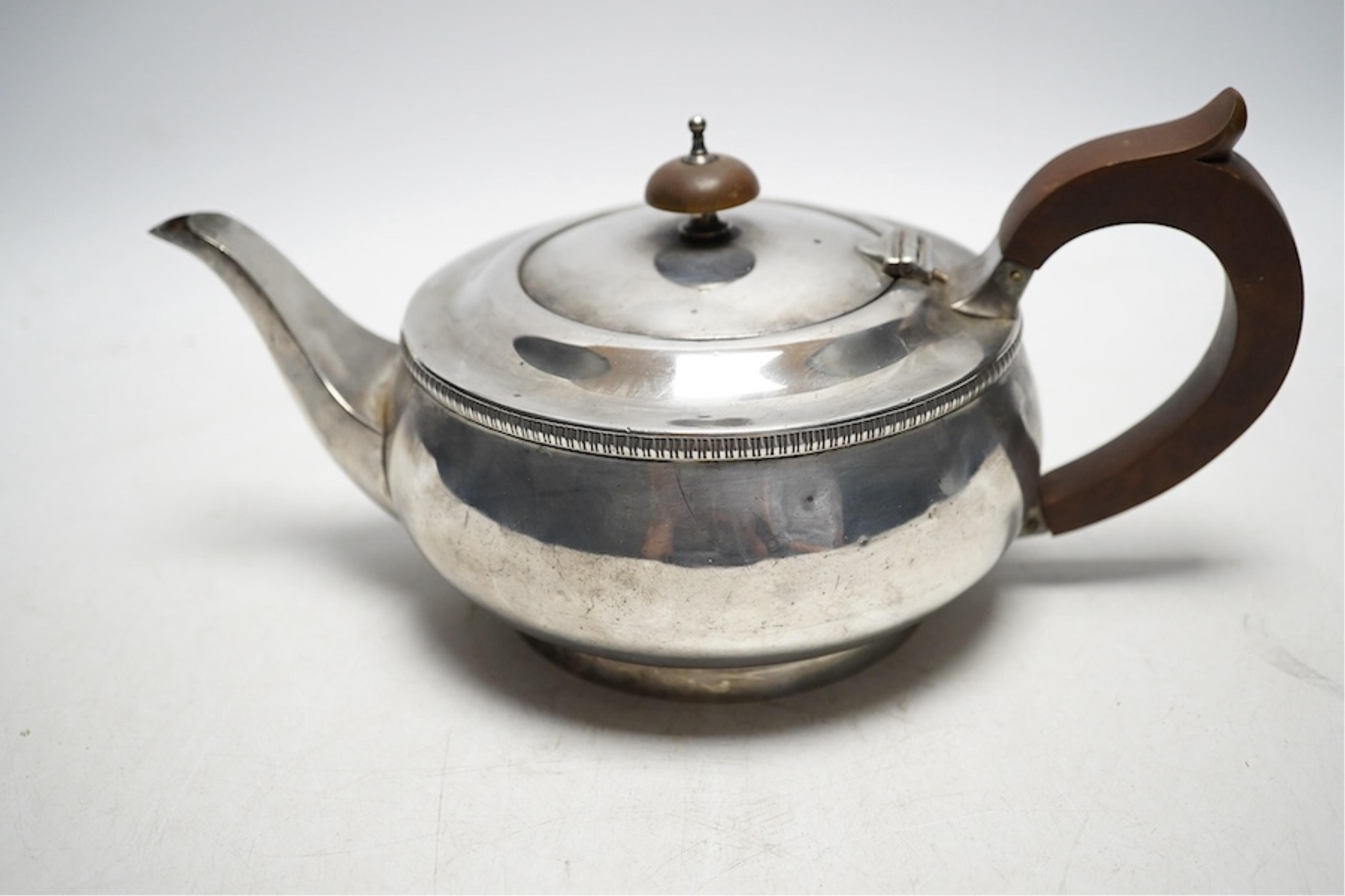 A George V silver teapot, JBC and S Ltd, London 1934, 595g gross. Condition - fair